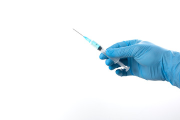 a hand holds a syringe with the ready-to-use vaccine