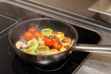 Frying vegetables in pan