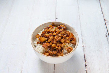 braised pork on rice is Minced pork served with pickles on top of steamed rice