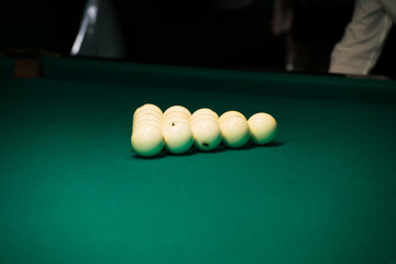 Sports game of billiards on a green cloth