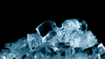 Top view of ice rotation on black background. Close up.
