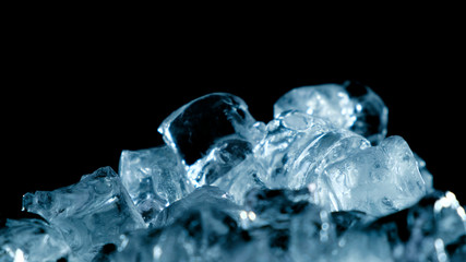 Obraz premium Top view of ice rotation on black background. Close up.