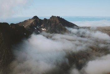 Mountains and clouds landscape in Norway summer travel wilderness nature scenic aerial view explore Senja island