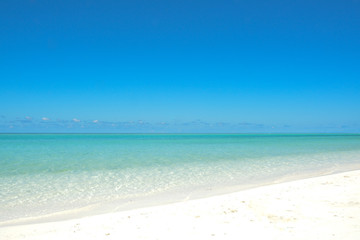 Fototapeta na wymiar Tropical white sand beach, blue water and blue sky. Maldives.