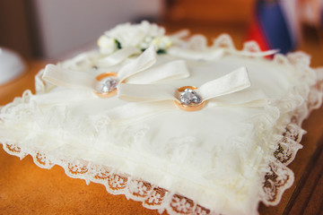 lie on a pillow wedding rings