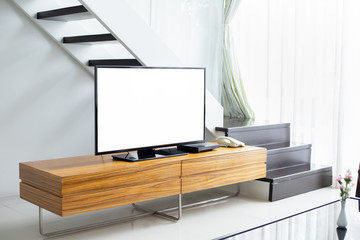 Smart TV wide screen with white panel stand on cabinet wooden in the modern living room. Concept of...