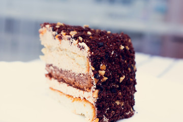Slice of chocolate cake. Piece of Cake on a Plate. Sweet food, close up