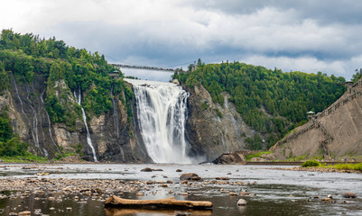 Cloudy summer day with insane view of beautiful and powerful Montmorency waterfall 