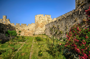 Inside medieval Rhodes was a fortress wall that separated the quarters of the aristocracy from the...
