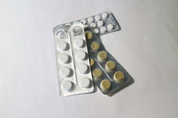 several packs of colored pills in a pack