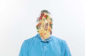 Male face covered with oilcloth, cellophane and unhealthy food, hard to breathe. People lost their...
