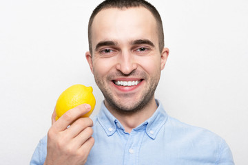 Person with lemon, portrait, white background