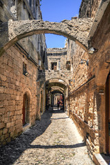 In the narrow streets of medieval Rhodes, there are two-story houses of merchants and artisans, connected by arches and passages. This ensures the stability of buildings in case of an earthquake.   
