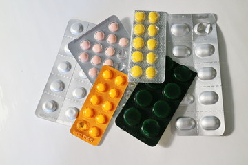 several packs of colored pills in a pack