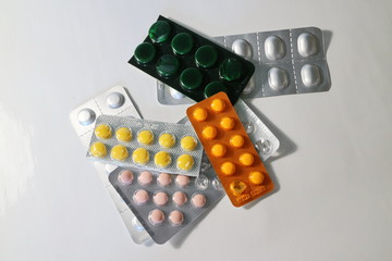 several packs of colored pills in a pack