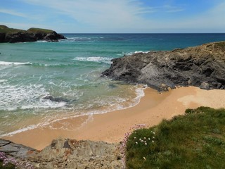 View over Cornwall beach and rocks out to sea on a sunny summers day