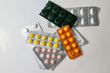 several packs of colored pills in a pack