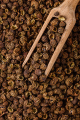 fragrant Sichuan pepper on white acrylic background