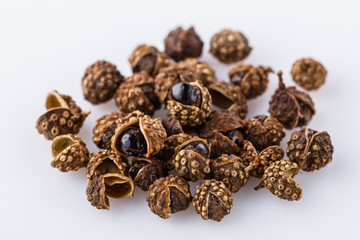 fragrant Sichuan pepper on white acrylic background