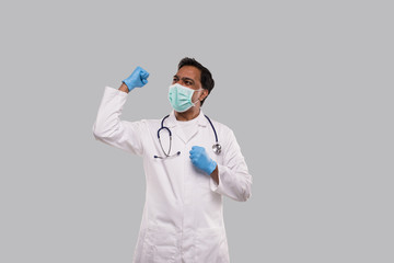 Doctor Excited Celebrating Success Wearing Medical Mask and Gloves Isolated. Indian Man Doctor Happy