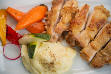 Da Nang Vietnam 10-17-2019 roasted chicken with mash potato and fried vegetables