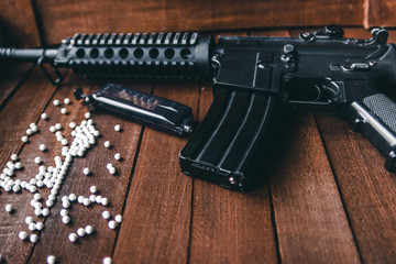 scattered balls airsoft assault rifle near