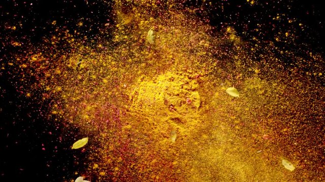 Exotic spices flying up in slow motion. Spices explosion on black background. Full HD 240 fps