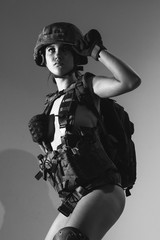 Beautiful girl in military clothes. studio shot