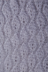 top view macro handmade openwork binding gray, knitted, woolen scarf with pattern