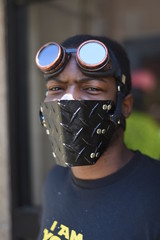 Stylish and fashion american man wearing a mask during coronavirus time. Face ultra fashion mask for protection face in pandemic isolation time. 