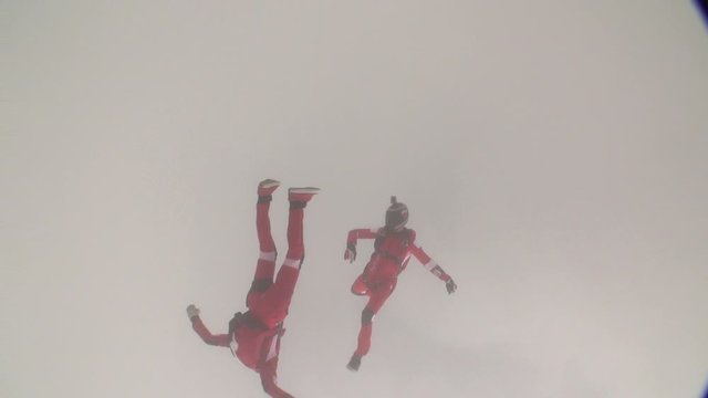 Skidiver rotates in free fall. Extreme sport concept.