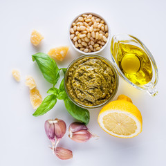 Delicious traditional Italian pesto sauce on a white background