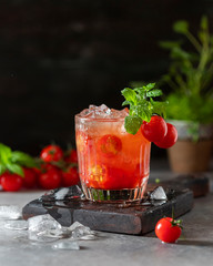 Ice tomato juice in a glass goblet.