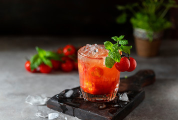 Ice tomato juice in a glass goblet.