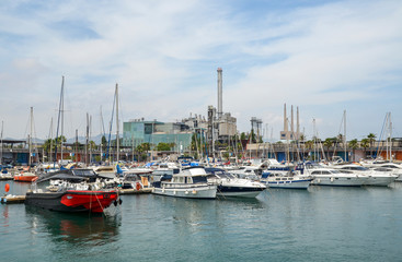 Fototapeta na wymiar Yachts and sailing boats moored in the marina in harbor of Barcelona