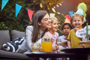 Kids birthday party.Happy family at a birthday party.