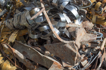 Pile scrap metal shavings isolated on white background. Scrap metal on recycling plant site