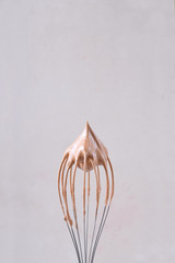 Whipped cream peak on the balloon whisk