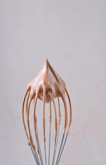 Whipped cream peak on the balloon whisk