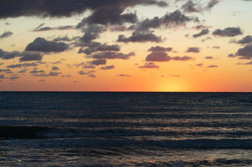 Naklejka na ściany i meble Sunrise on sea shore