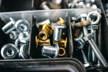 metallic set of small tools for the repair of furniture, plastic box