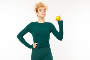 Portrait of beautiful caucasian woman in green dress gesticulates isolated on white background