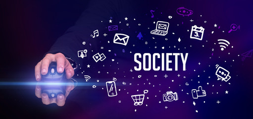 hand holding wireless peripheral with SOCIETY inscription, social media concept