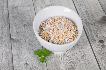 Raw oats in the bowl