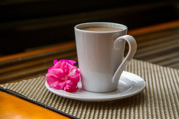 cup of coffee and rose