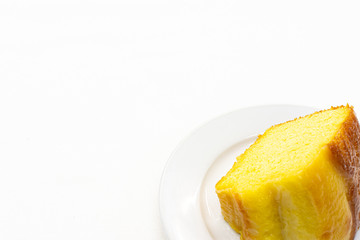 Closeup piece of sweet lemon cake served on white plate,Copy space.