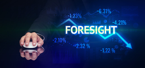 male hand holding wireless peripheral with FORESIGHT inscription, modern business concept