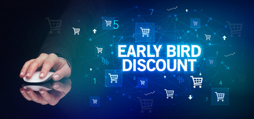 hand holding wireless peripheral with EARLY BIRD DISCOUNT inscription, online shopping concept