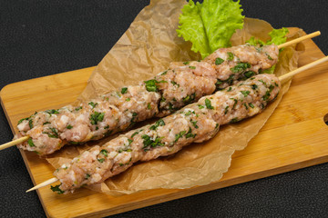 Raw minced pork skewer kebab for grill