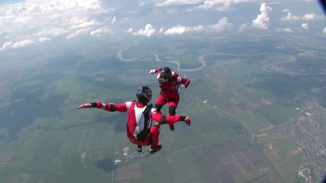 Skidiver rotates in free fall. Extreme sport concept.